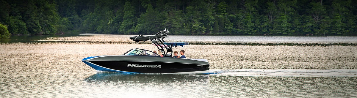 Four people riding a black 2016 Moomba through a lake
